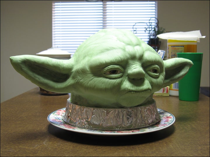 A cake featuring Yoda's head in light green